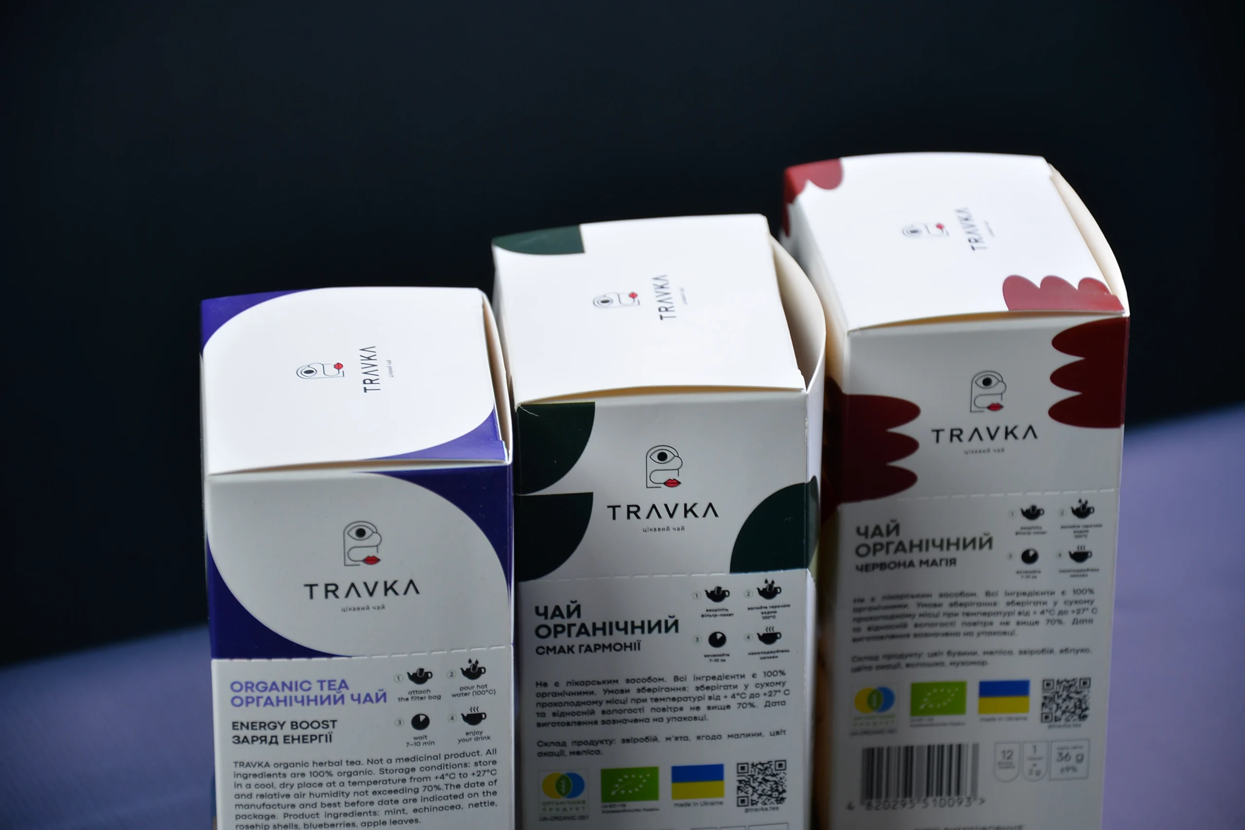 Картонні коробки для чаю Travka з білими верхніми клапанами та кольоровим оформленням
